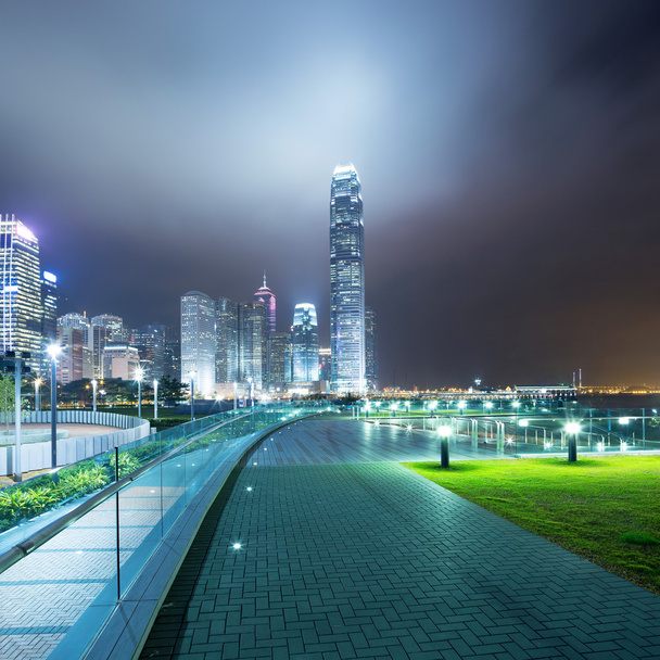 pathway in the night with modern city background - Photo, Image