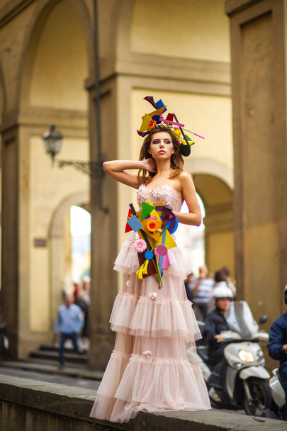 a bride in a pink wedding dress with an unusual bouquet and decoration in Gorova in Florence, Italy. - Photo, Image