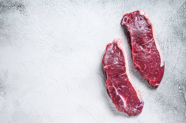 Fresh Raw sirloin beef meat steak. white background. Top view. Copy space - Photo, Image