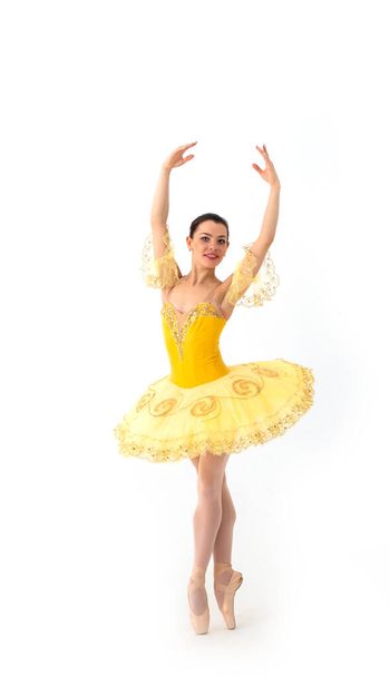 Young modern ballet dancer in yellow dress isolated on white background - Zdjęcie, obraz