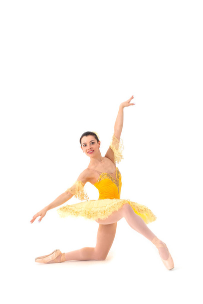 Young modern ballet dancer in yellow dress isolated on white background - Fotografie, Obrázek