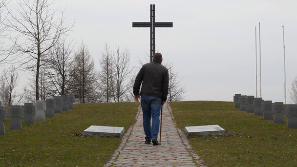 Man with walking stick near soldier's grave episode 5 - Footage, Video