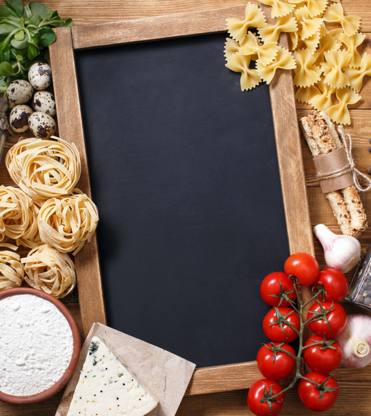 Italian food on vintage wood background with chalkboard - Fotoğraf, Görsel