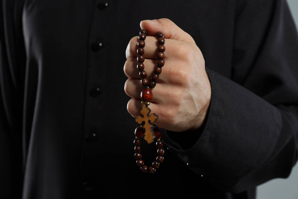 Priest in cassock with rosary beads, closeup - Φωτογραφία, εικόνα