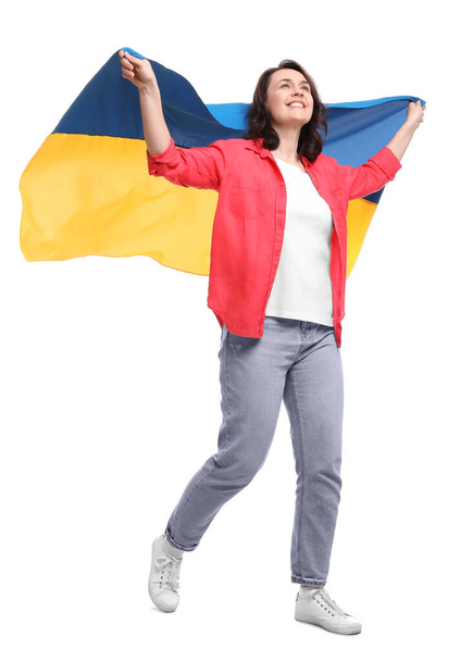 Happy woman with flag of Ukraine on white background - Foto, Imagen