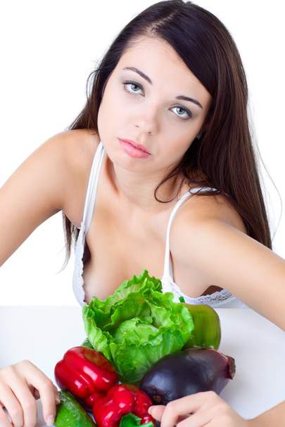 Chica joven con verduras sobre fondo blanco
 - Foto, Imagen