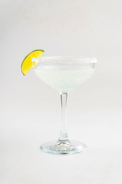 Isolated glass of margarita cocktail with lime - Photo, Image