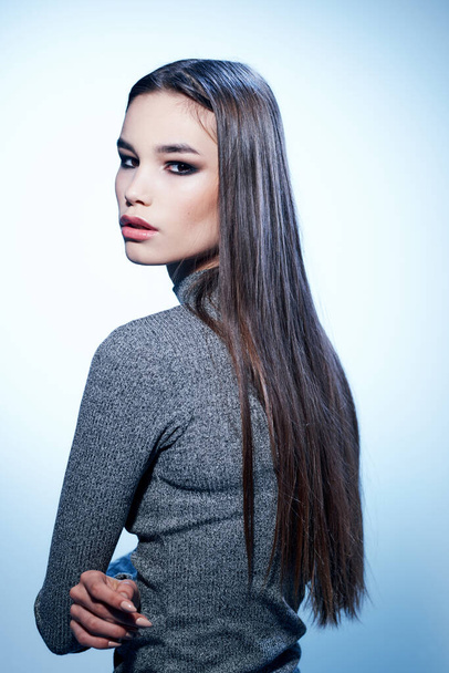 Woman in gray sweater hairstyle Model back view makeup - Zdjęcie, obraz