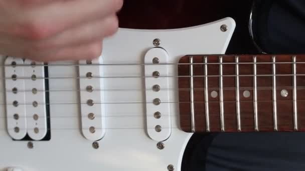 Playing guitar close up. Musician playing electric guitar. hand plays guitar - Footage, Video