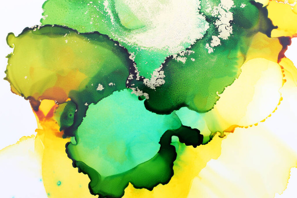 art photography of abstract fluid art painting with alcohol ink, green, yellow and gold colors - Foto, imagen