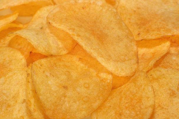 Crisps. Crisps with spices. Potato chips. Crisps close-up. - 写真・画像