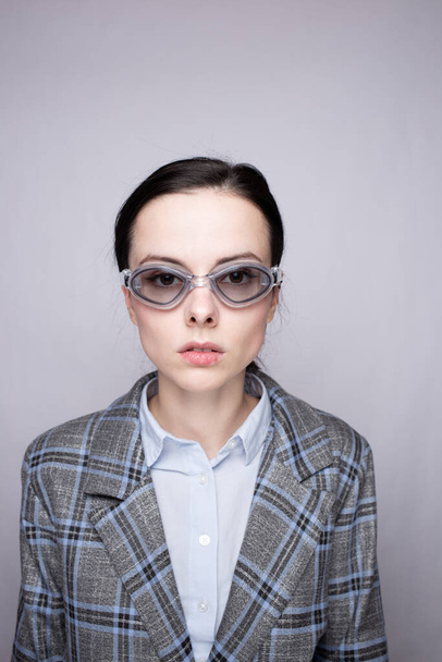 woman office worker wearing swimming goggles - Fotó, kép