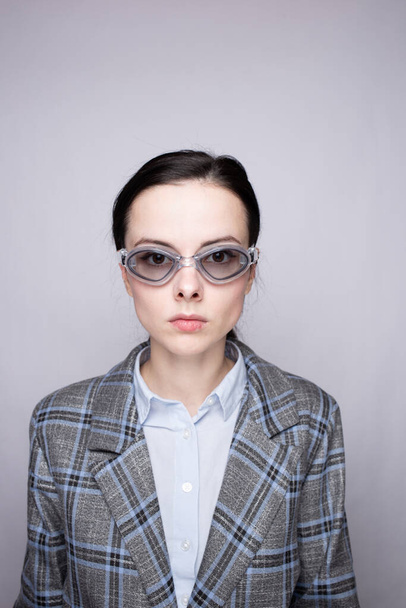 woman office worker wearing swimming goggles - Фото, изображение