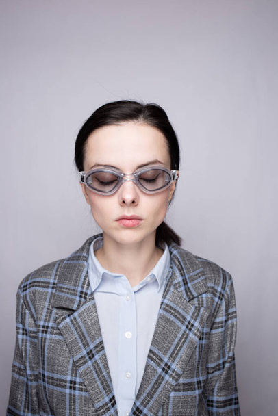 woman office worker wearing swimming goggles - Foto, afbeelding