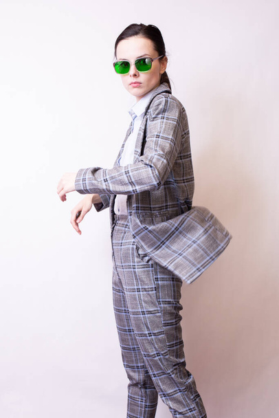 woman in green glasses and gray plaid suit - Fotografie, Obrázek