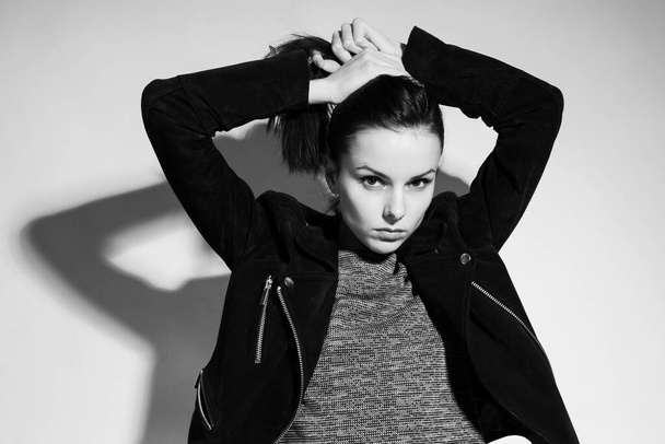 beautiful woman in leather jacket, black and white photography - Zdjęcie, obraz