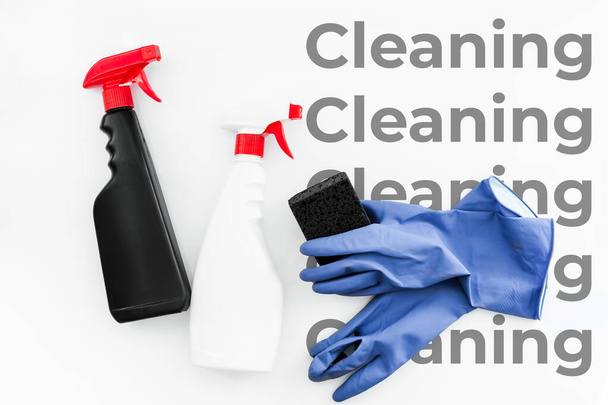 set of household chemicals for cleaning on a white background. washcloth, gloves, bottles with detergents close-up. mockup - Photo, Image