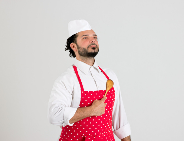 Шеф-повар держит ложку на сердце
 - Фото, изображение