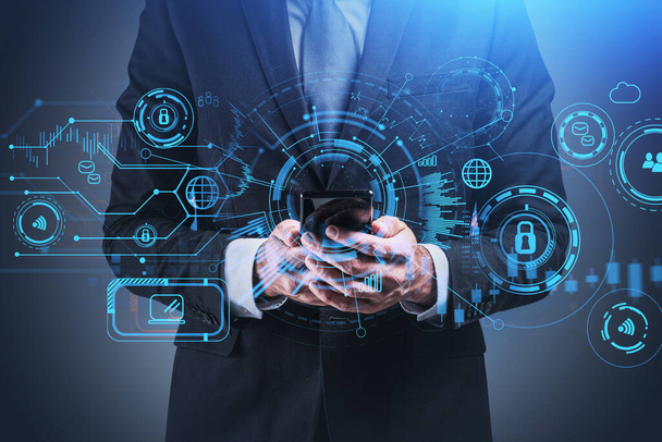 Businessman wearing formal suit holds the smart phone surrounded by hologram and digital interface. Concept of international connection and cooperation, security and safety of data and information - Fotoğraf, Görsel