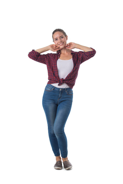 Full length portrait of smiling young woman posing dancing isolated on white background, casual people - Valokuva, kuva