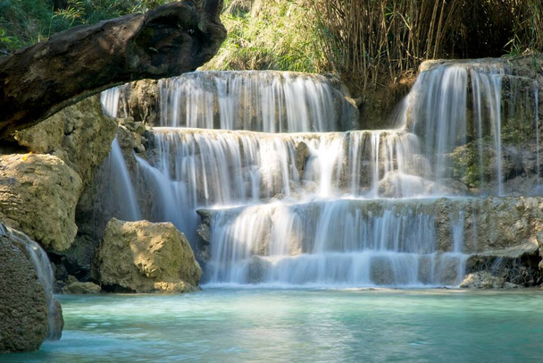 Beautiful slow motion blur of running water at Tat Kuang Si Waterfall, Luang Prabang, Laos. - Photo, Image