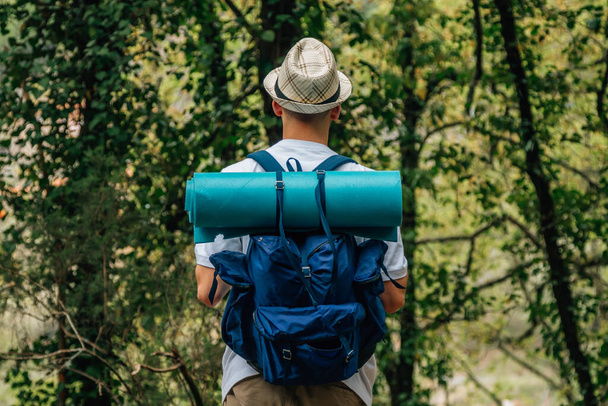 young man with backpack in nature - Photo, Image