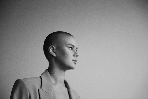 Portrait of a beautiful bald woman. Black and white shot. - Photo, Image