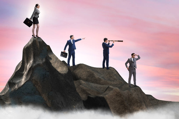 Business people at the top of mountain in career concept - Photo, Image