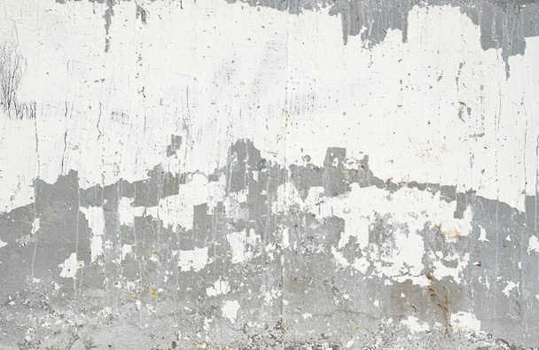 La textura de una pared de hormigón gris con manchas blancas. - Foto, Imagen
