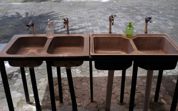 The simple sink is worn out and is rarely used  - Photo, Image