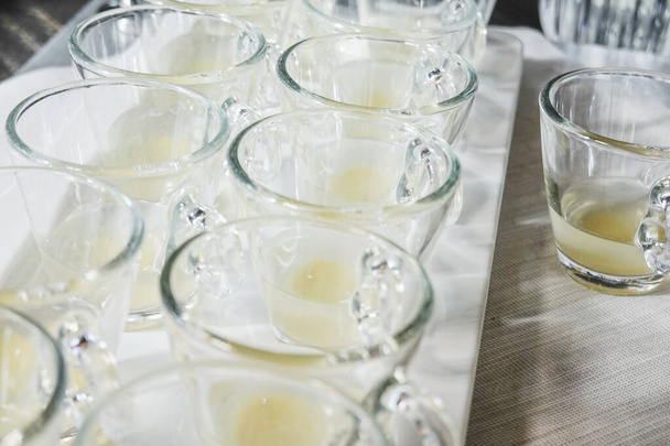 Halmstad, Sweden, Glasses with ginger shots at a buffet. - 写真・画像