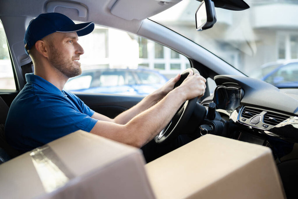 Delivery Worker Man In Uniform In Car - Photo, Image
