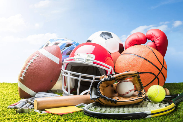 Various Sport Equipment And Balls On Grass - 写真・画像