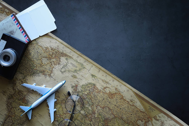 Travel concept. Map on the table and model aircraft. - Photo, Image