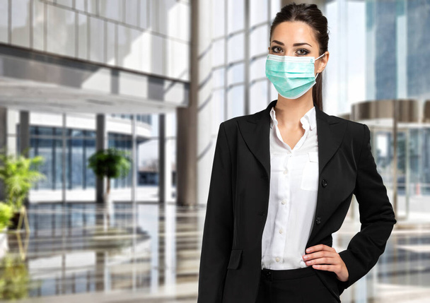 Smiling businesswoman wearing a mask, coronavirus concept - Фото, зображення