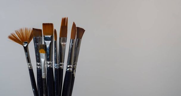 artistic brushes with colored oil on white background painter tools - Foto, immagini