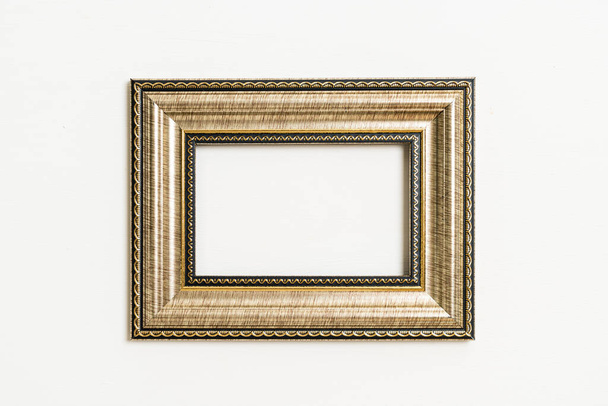 empty picture frame on white wall background with copy space - Photo, Image