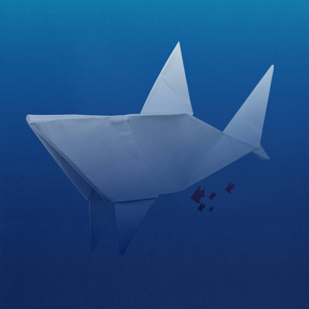 Abstract illustration of shark in deep and dark blue ocean background swimming with small fishes and made from paper using paper folding technique origami. Matte craft paper texture background - Foto, afbeelding