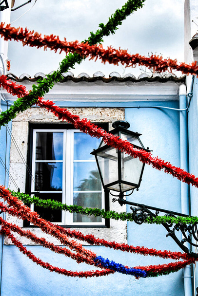 Streets adorned with garlands for the festivities of Saint Anthony in the Alfama neighborhood in Lisbon - Photo, Image