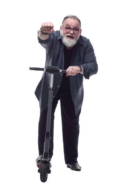 Mature, bearded man with an electric scooter. - Zdjęcie, obraz