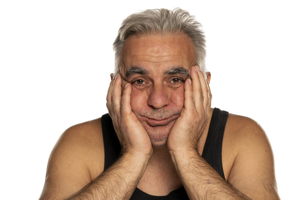 Sad and bored unshaven middle aged man with short gray hair - 写真・画像