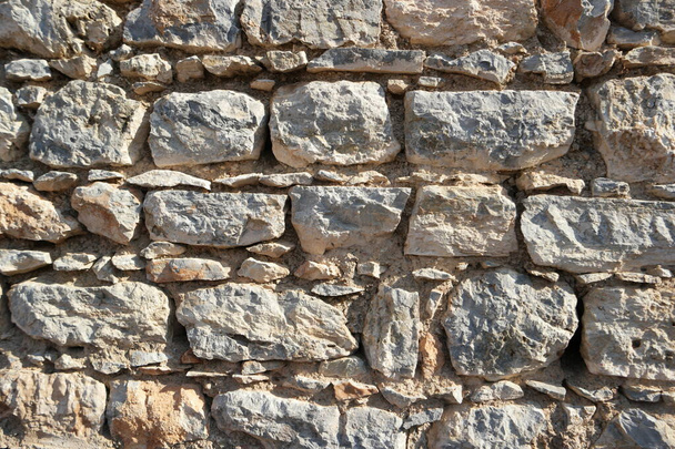 Tekstura starego kamiennego tła powierzchni ściany. - Zdjęcie, obraz