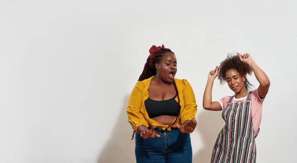 Picture of black women having fun and dancing together - Photo, image