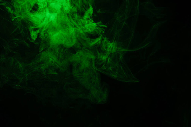 Green and pink steam on a black background. Copy space. - Φωτογραφία, εικόνα
