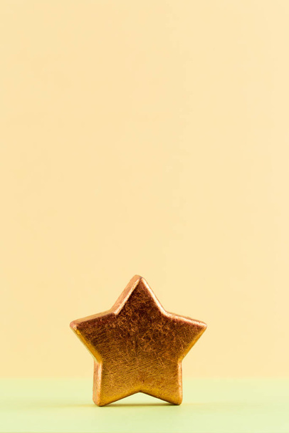 Christmas star, decor on pastel colored background. Christmas or New Year minimal concept. - Foto, imagen