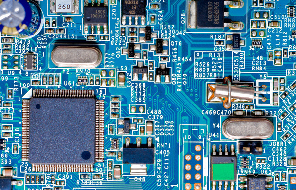 Close-up photograph of a blue circuit board - 写真・画像