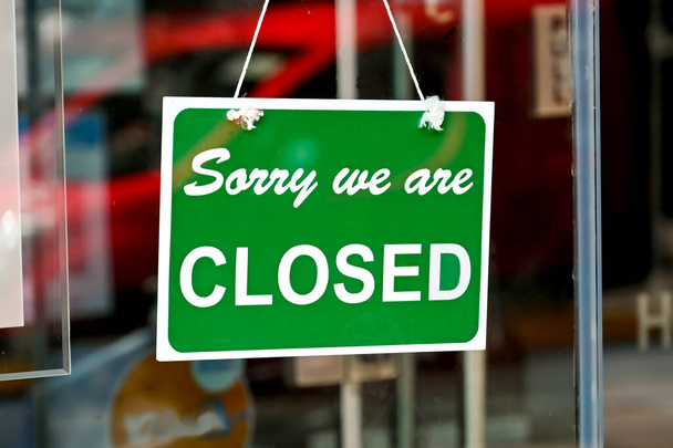 Closed sign on the front window of a shop during the national lockdown for the pandemic. No people. - Photo, Image
