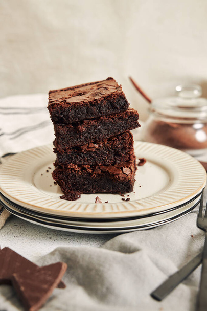 A vertical shot of deliciously prepared Brownies on a table - Photo, Image