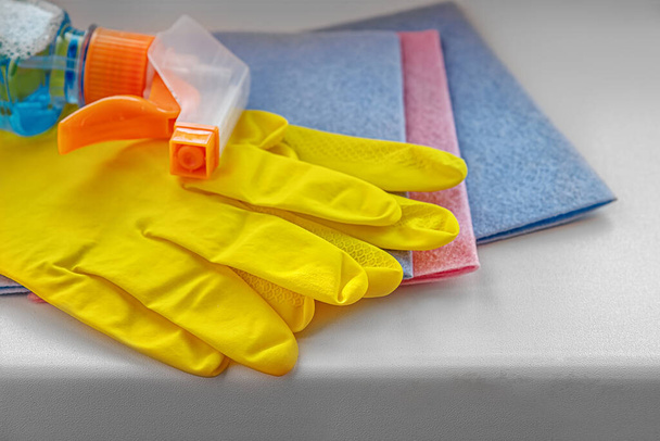 cleaning rags, washing liquid and rubber gloves close up  - Photo, Image