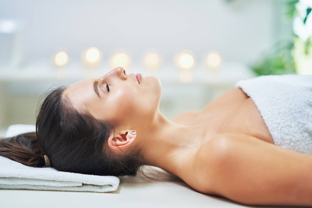Adult woman during relaxing massage in spa - Photo, Image